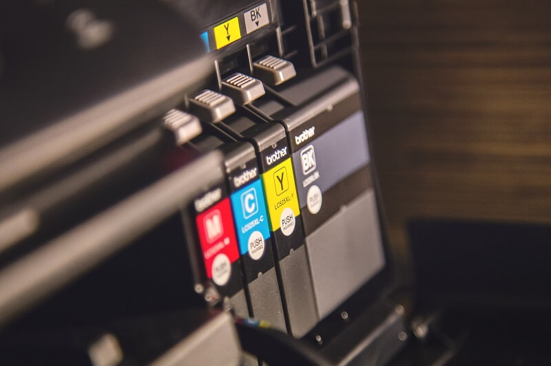 Clean and re-insert the cartridges to fix printer making black lines on paper
