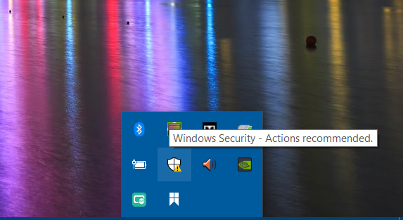 Click on  Windows Security icon on system tray