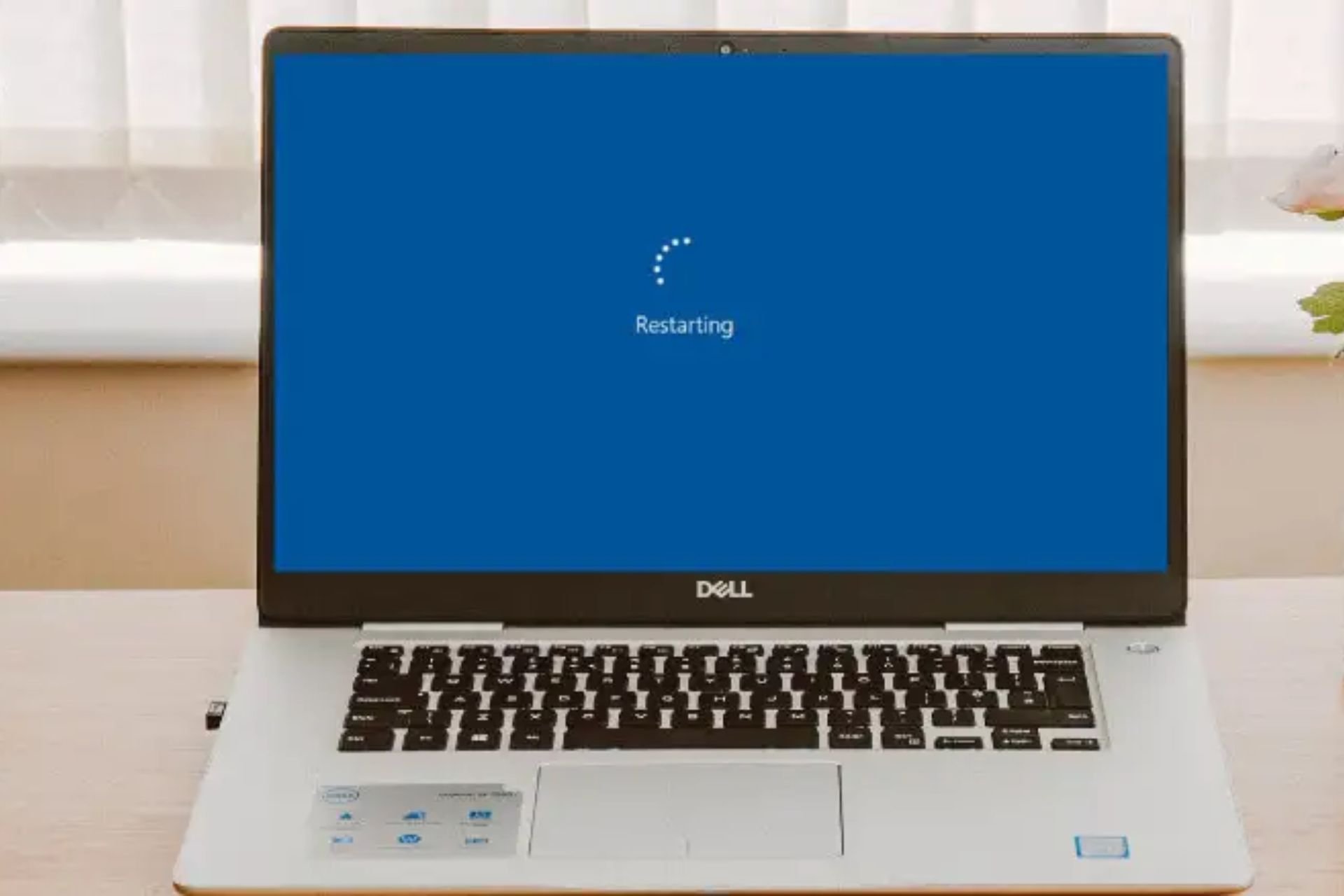 dell laptop stuck on restarting