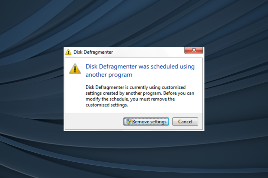 fix disk defragmenter was scheduled using another program in Windows